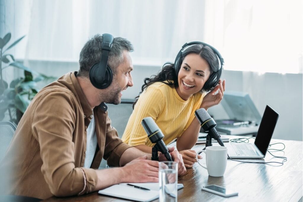 Branded Podcast - Man And Woman Talking On A Podcast.